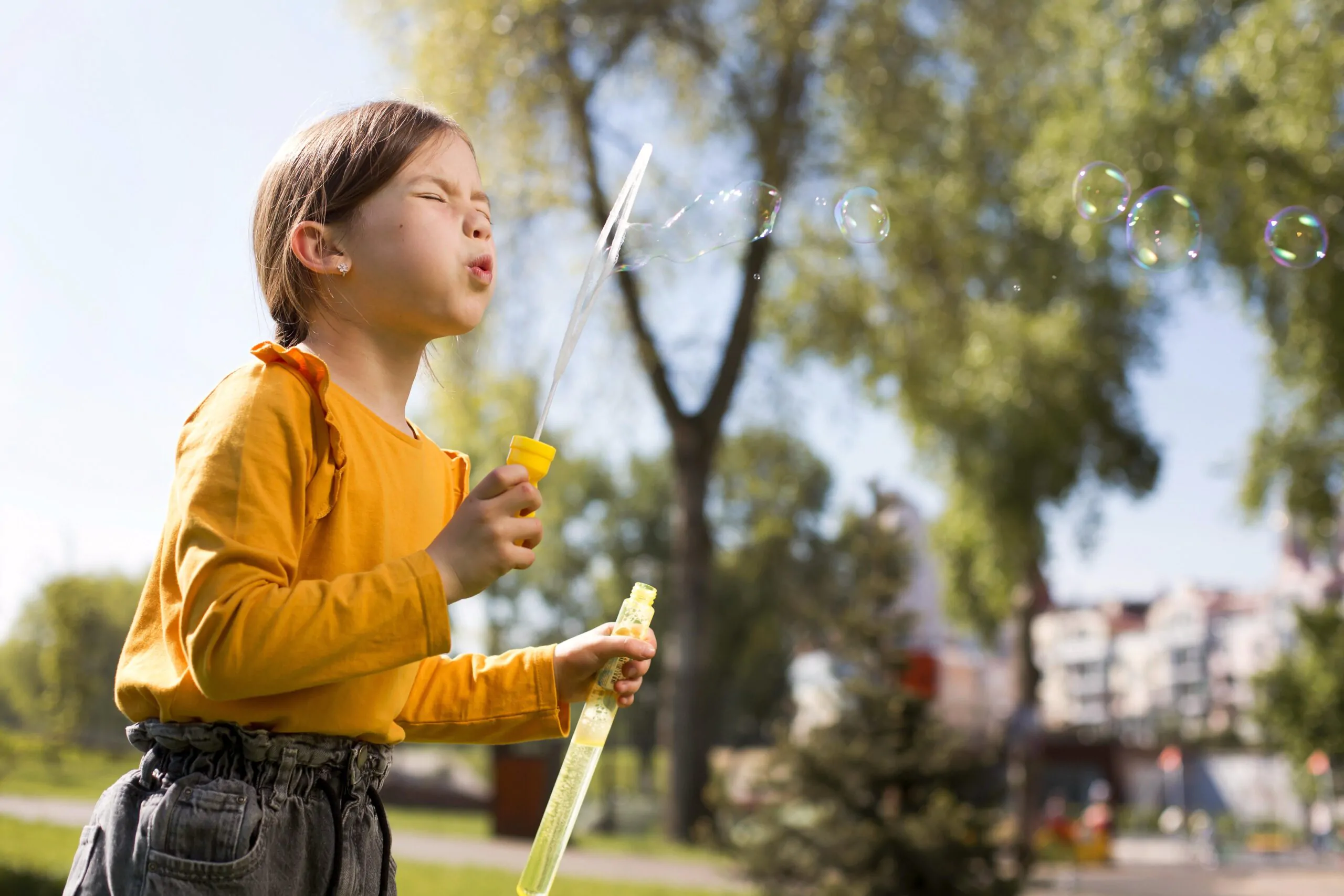 girl-making-soap-bubbles-medium-shot FreePik